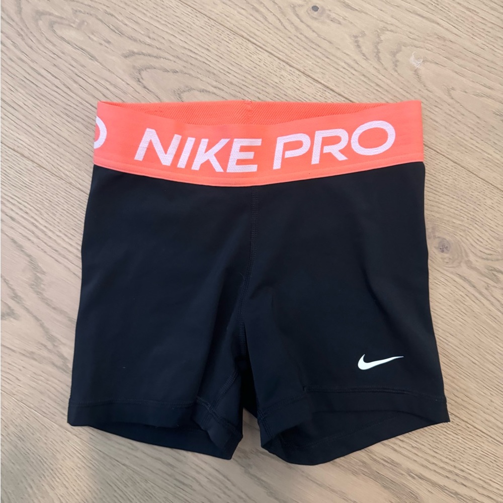 Orange/ Black Nike pros size XS